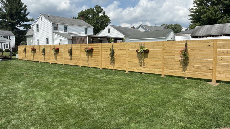 Horizontal-slat privacy fence built by AF Environmental