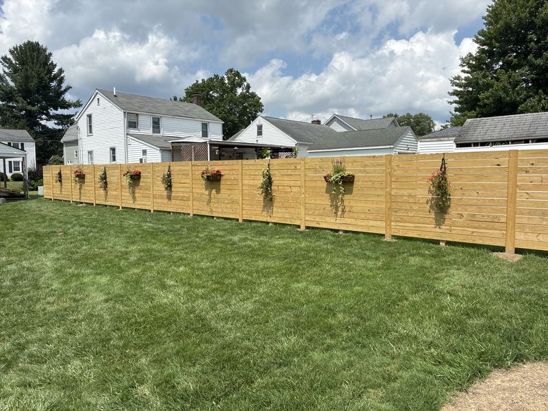 Horizontal-slat privacy fence built by AF Environmental