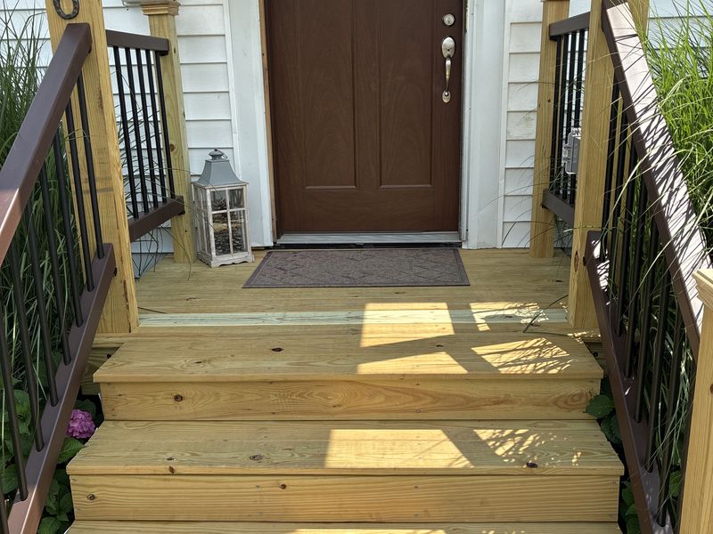 Rebuilt front porch steps and railings by AF Environmental